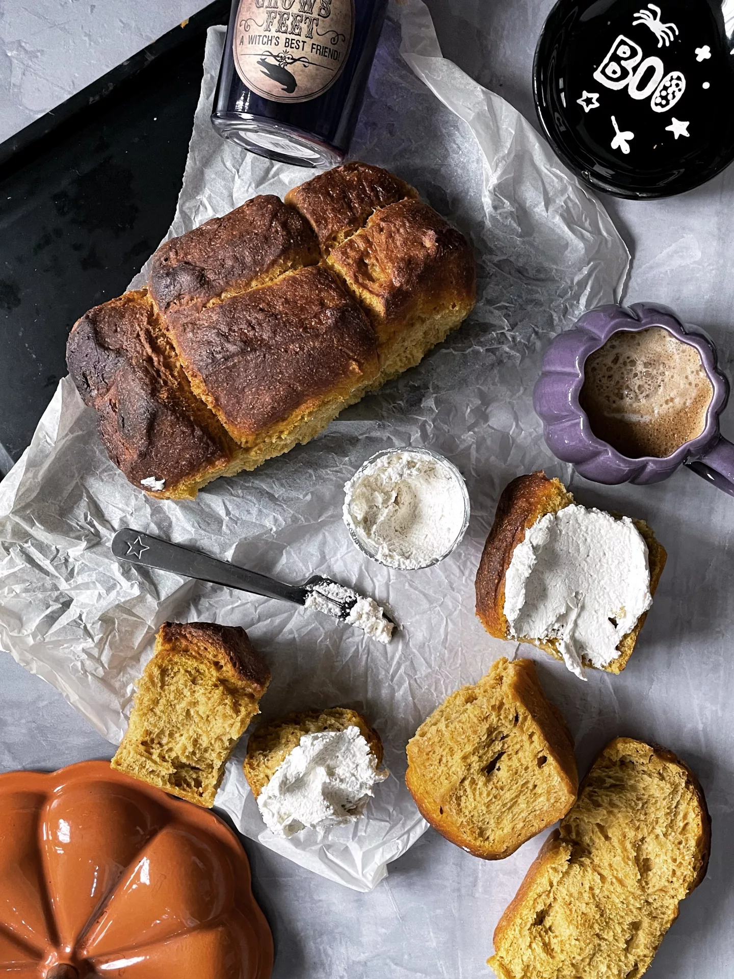 Flatlay of pumpkin bread with sweet cream cheese topping